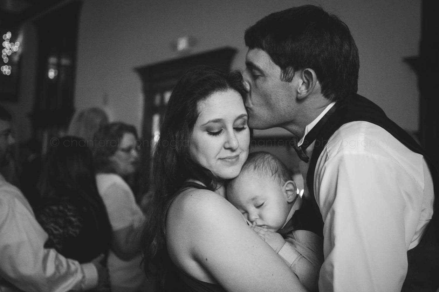 couple with baby at atlanta wedding reception