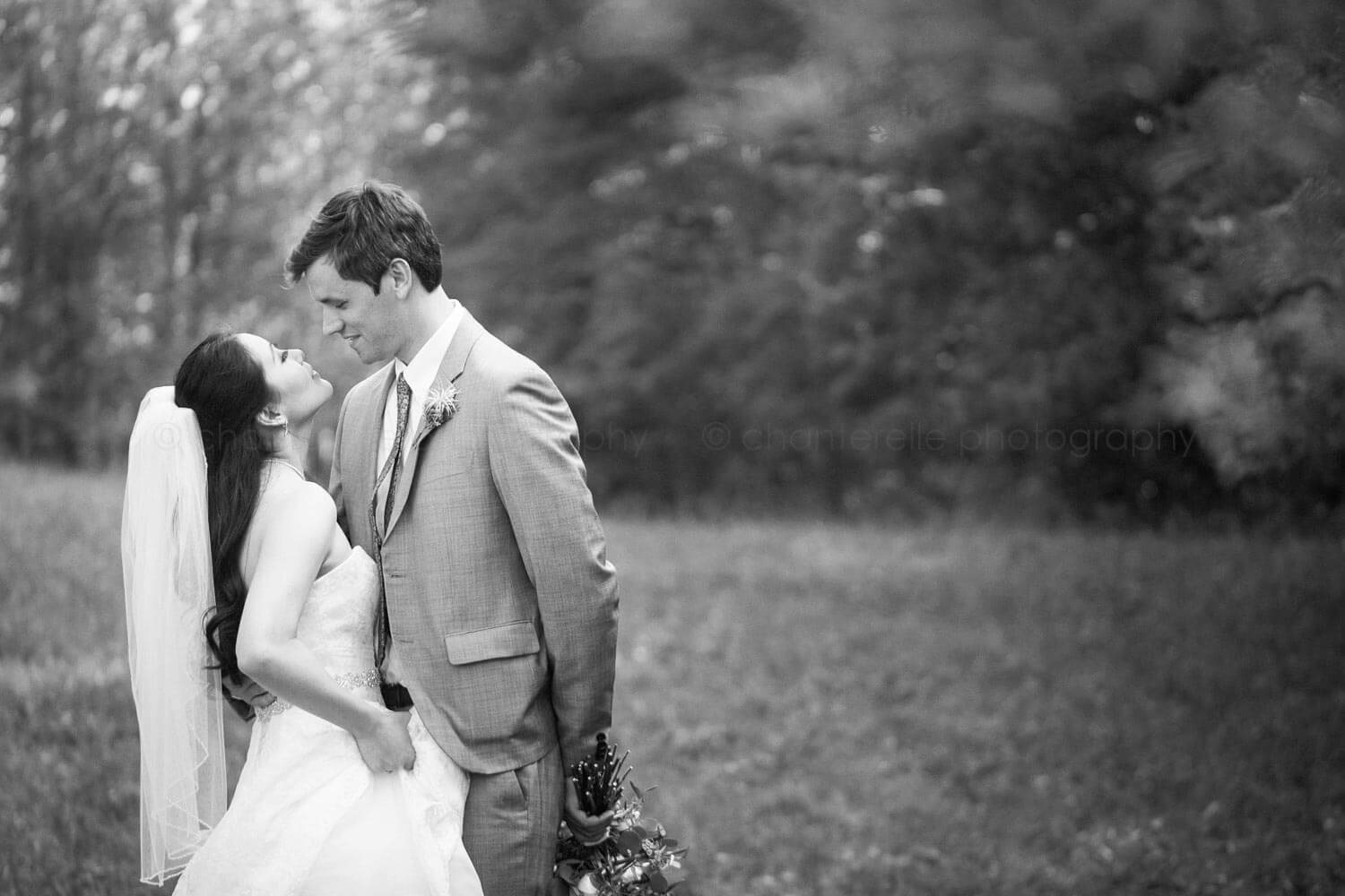 black and white outdoor bride and groom portrait