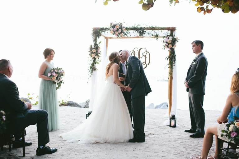 bride and groom kiss at key west beach wedding