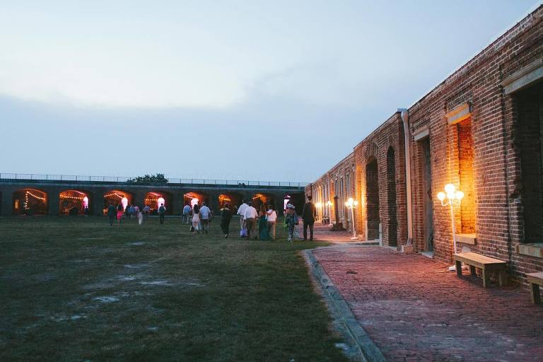 guests walking into fort zachary taylor state park wedding reception