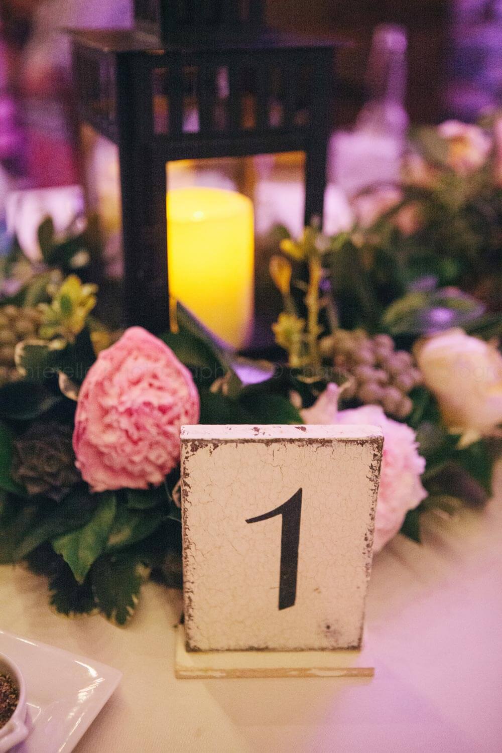lanterns with rustic table numbers at key west wedding reception