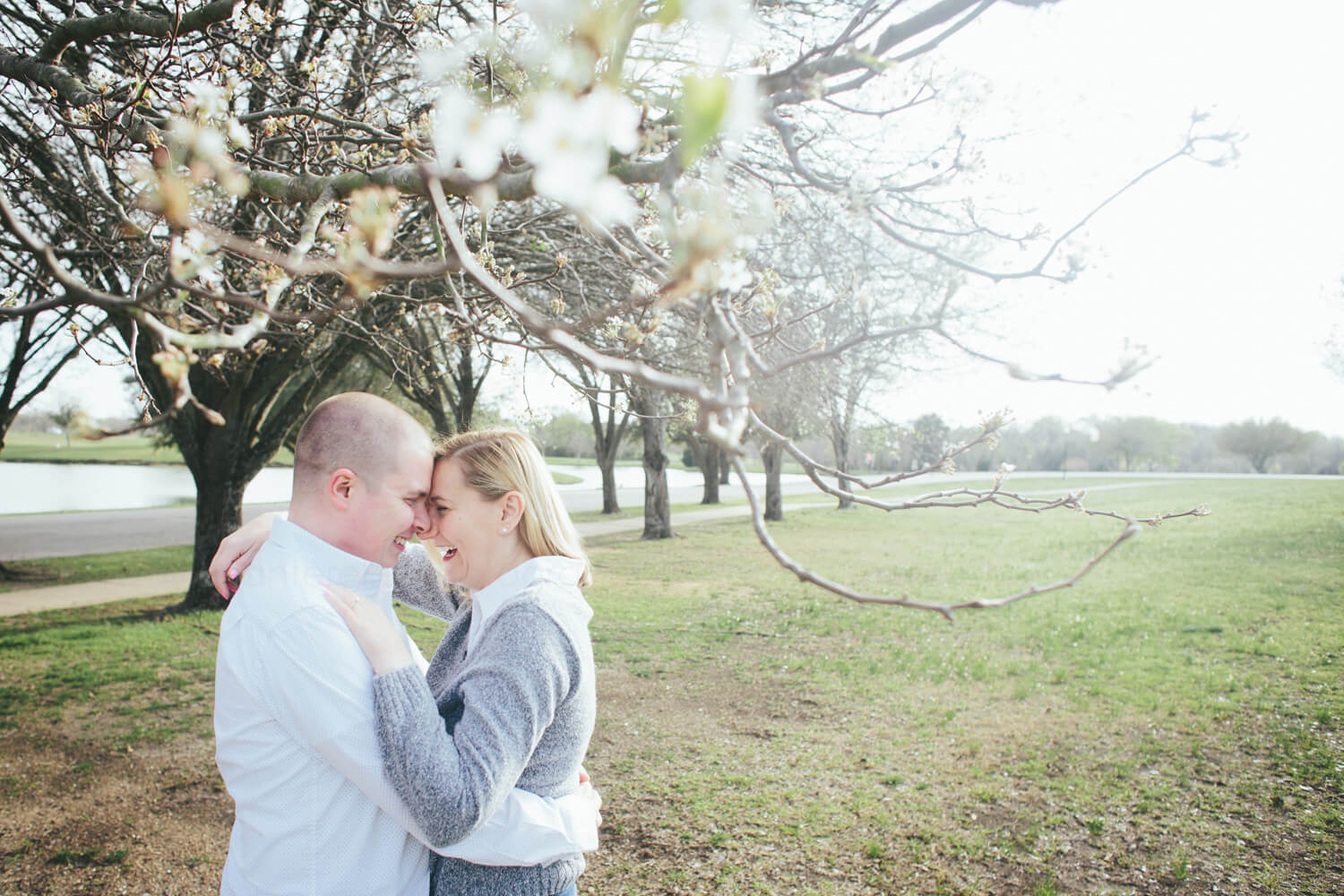 couple laughing during winter engagement session in montgomery
