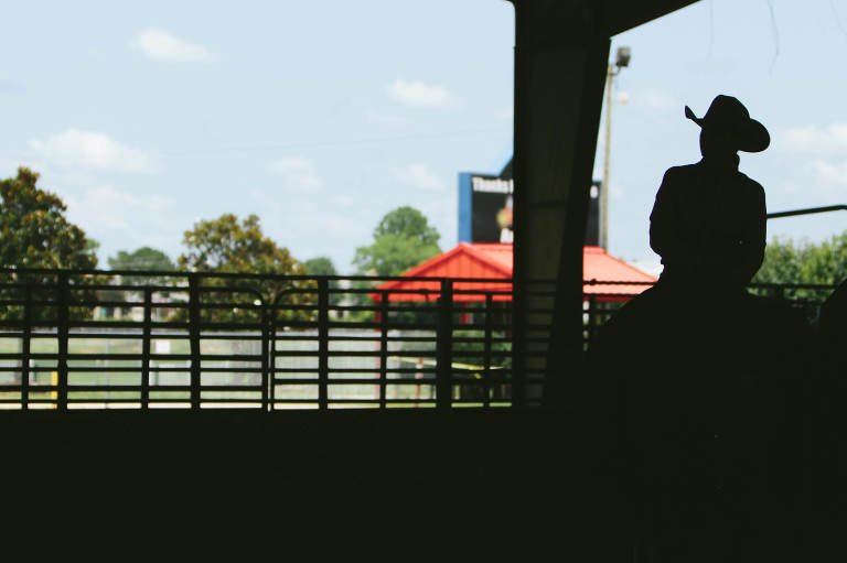 silhouette of cowgirl on horse