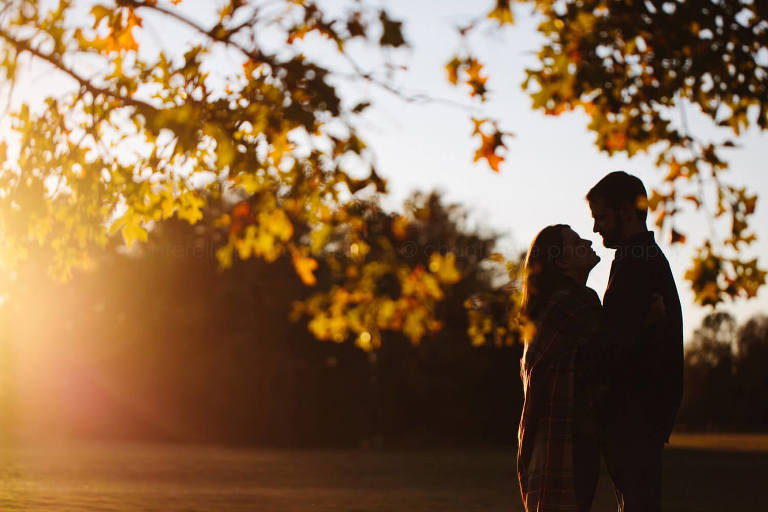 fall leaves in silhouette alabama engagement picture