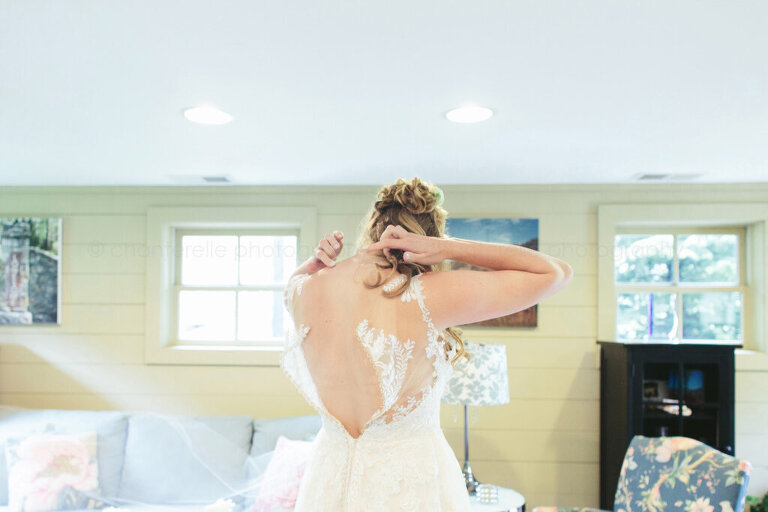 bride getting dressed for lonesome valley wedding