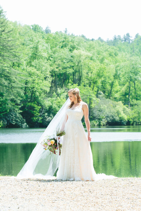 bride next to lake before north carolina wedding