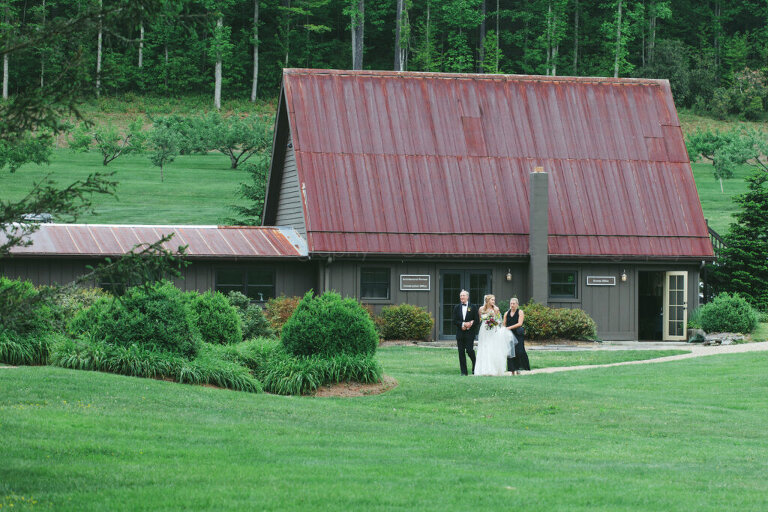 bride walking with mom and dad into lonesome valley wedding ceremony