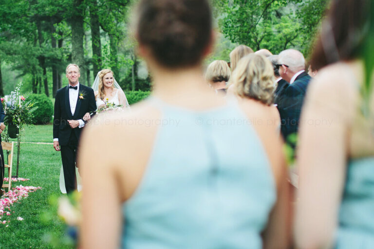 bride walking down the aisle with dad during north carolina wedding
