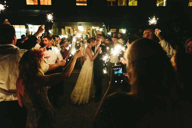 grand exit with sparklers outside canyon kitchen wedding reception