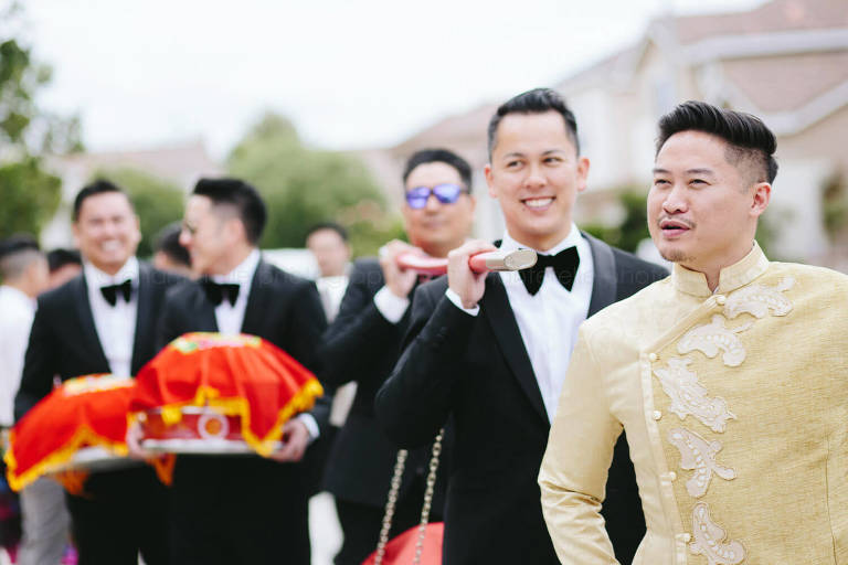 groom and groomsmen bearing gifts for vietnamese wedding