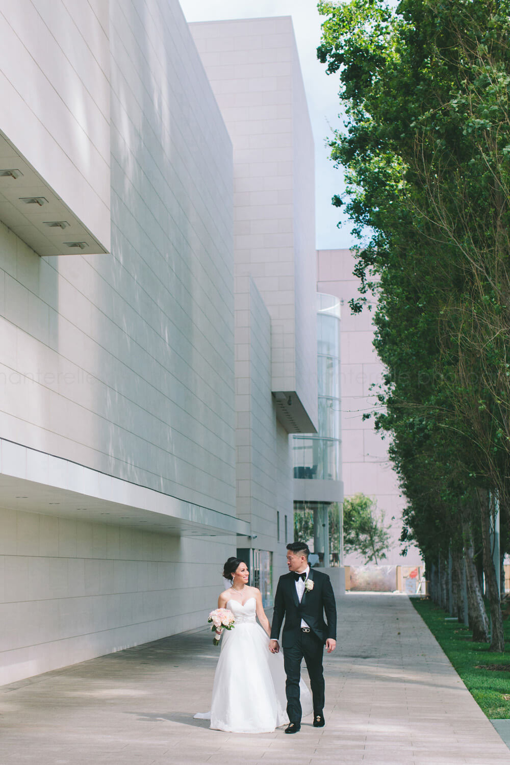 bride and groom walking at segerstrom center
