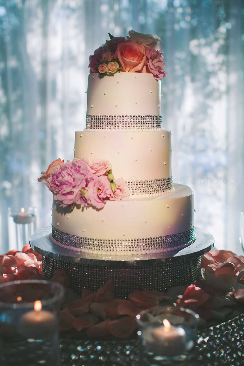 cake with flowers and rhinestone ribbon at the villa westminster