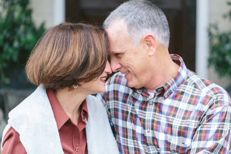 parents cuddle during montgomery portrait session