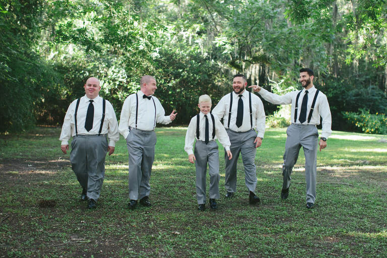 groom and groomsmen walking at the elms