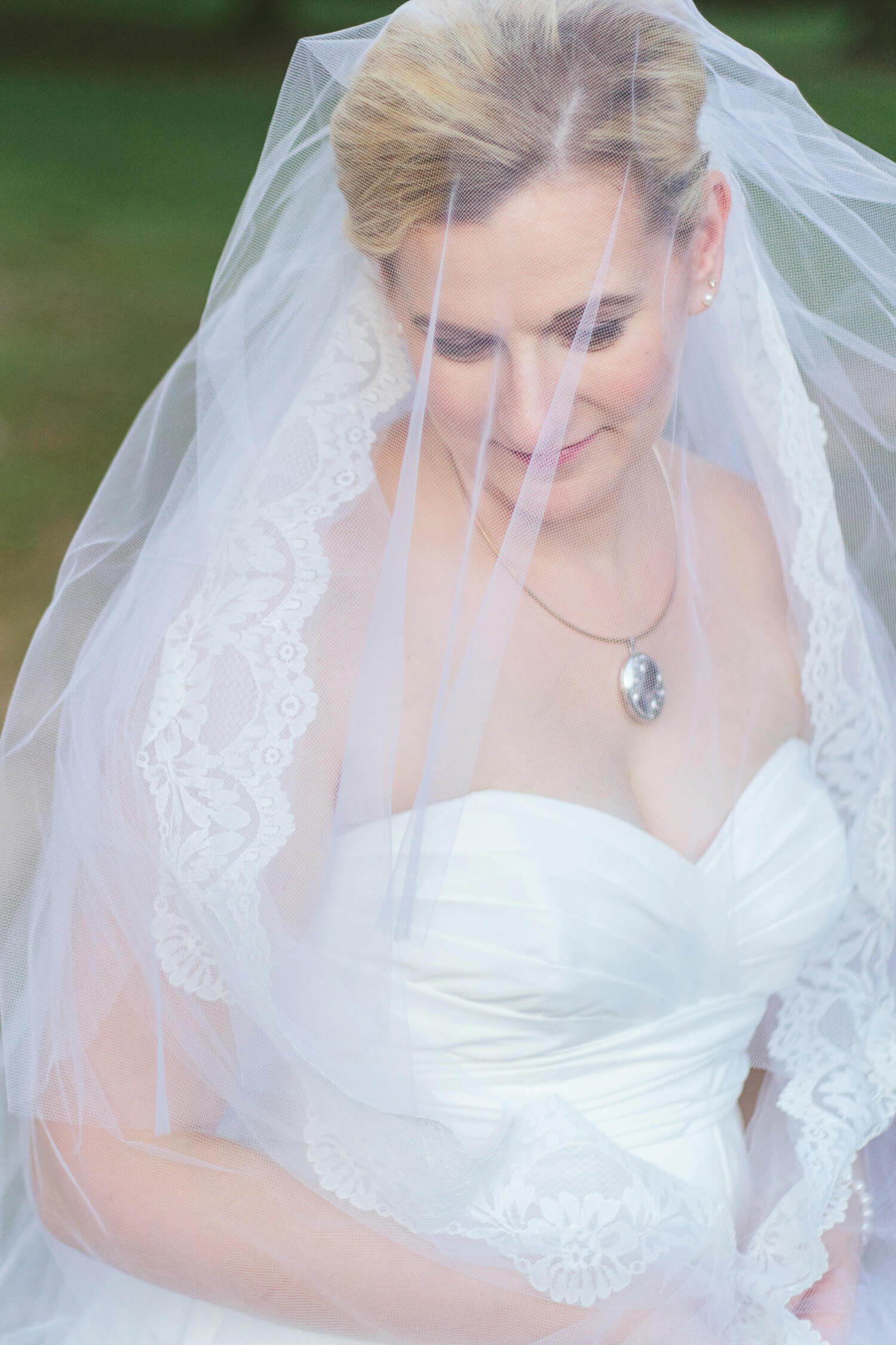 bride wearing moms veil at the elms