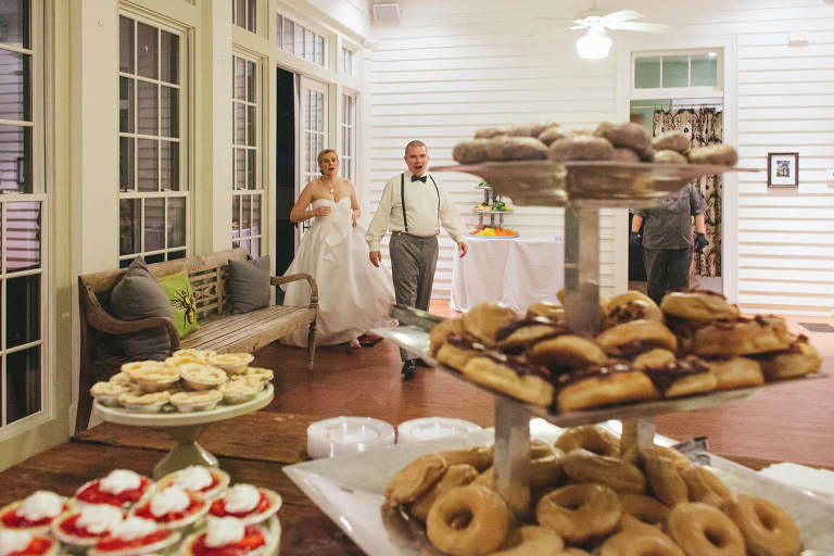 bride and groom seeing dessert table at the elms