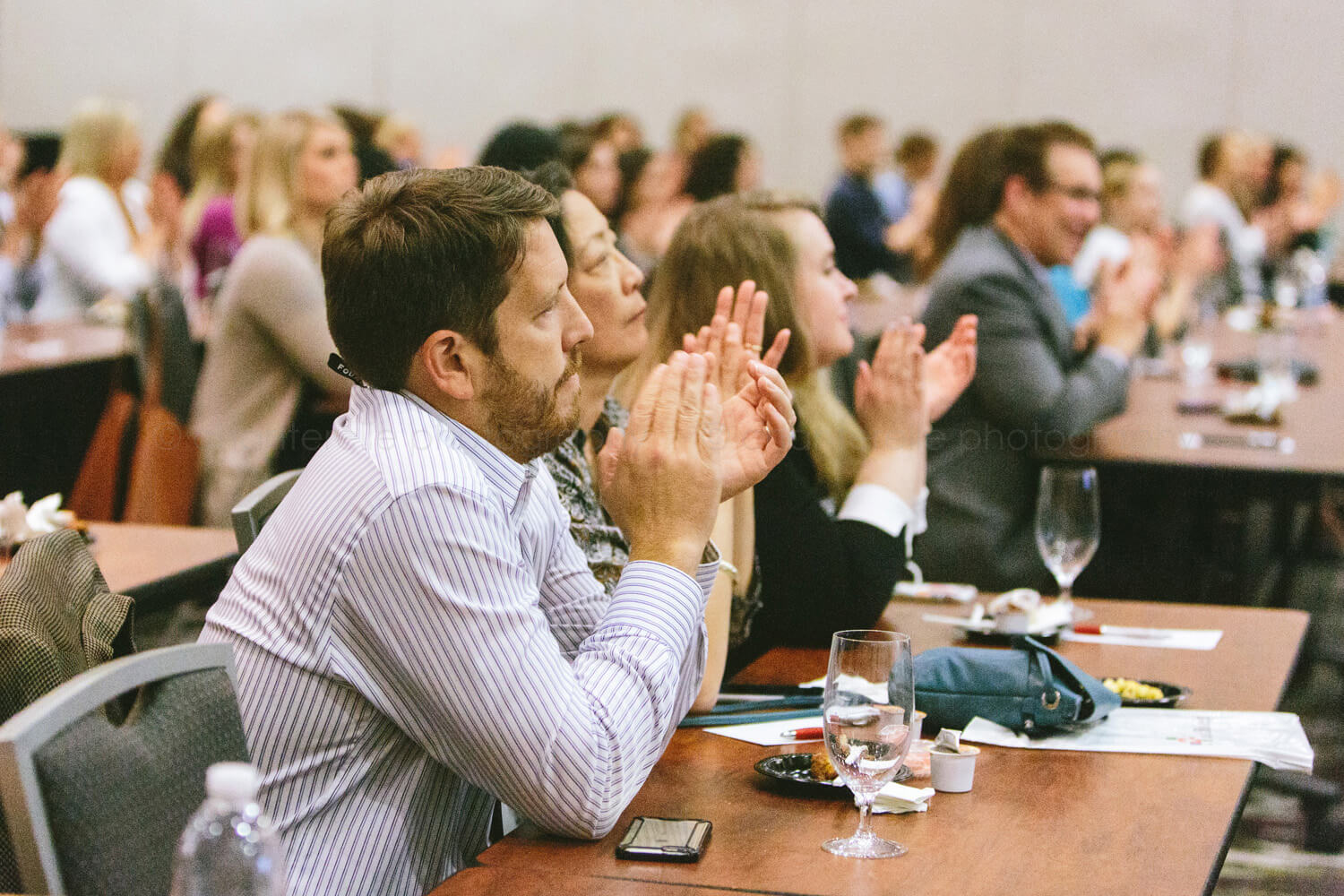 attendees applaud at ifec conference