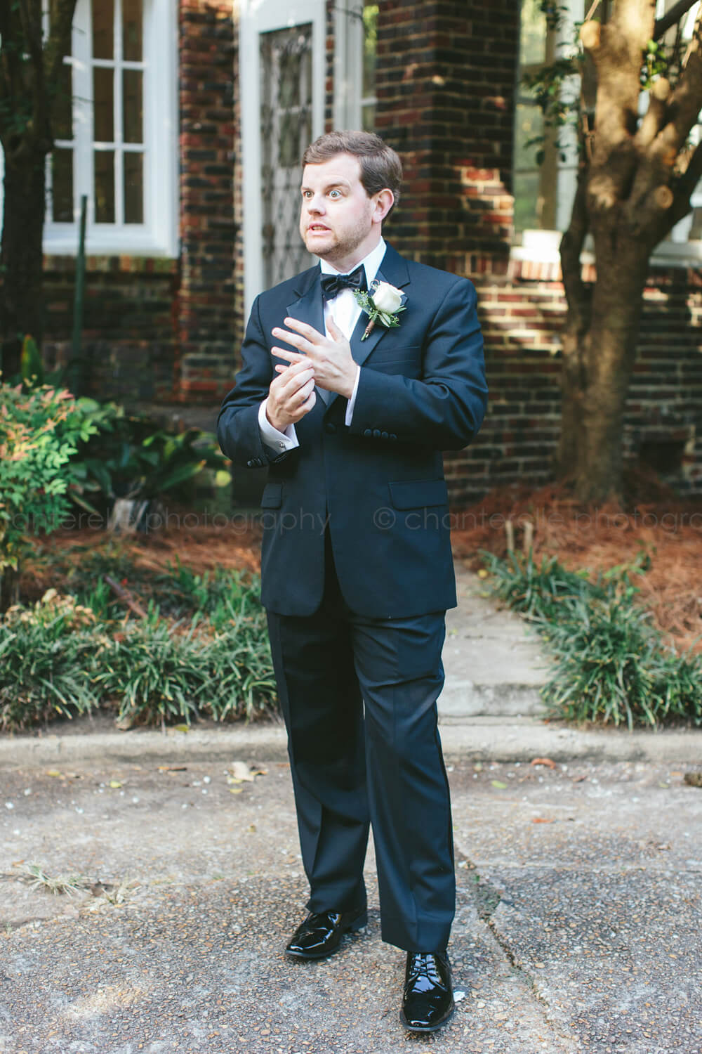 groom making funny face outside fitzgerald museum