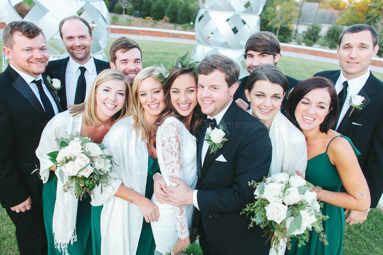 wedding party hugs at the montgomery museum of fine arts