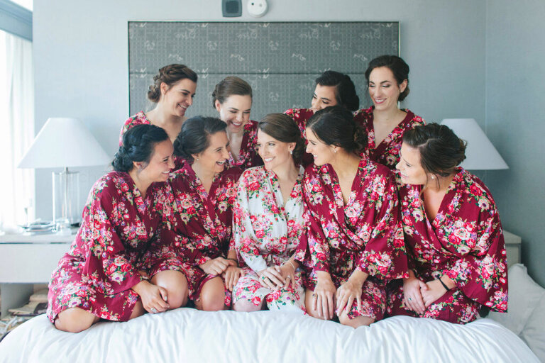 bride with bridesmaids in floral robes