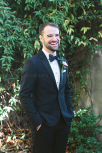 groom portrait in summerour courtyard