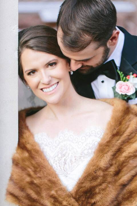 bride wearing fur stole outside atlanta church