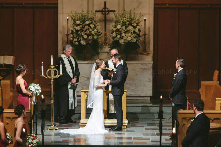 bride and groom exchange rings at atlanta church wedding