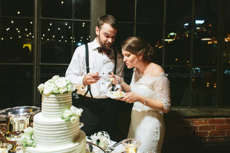 bride and groom eating cake at atlanta wedding