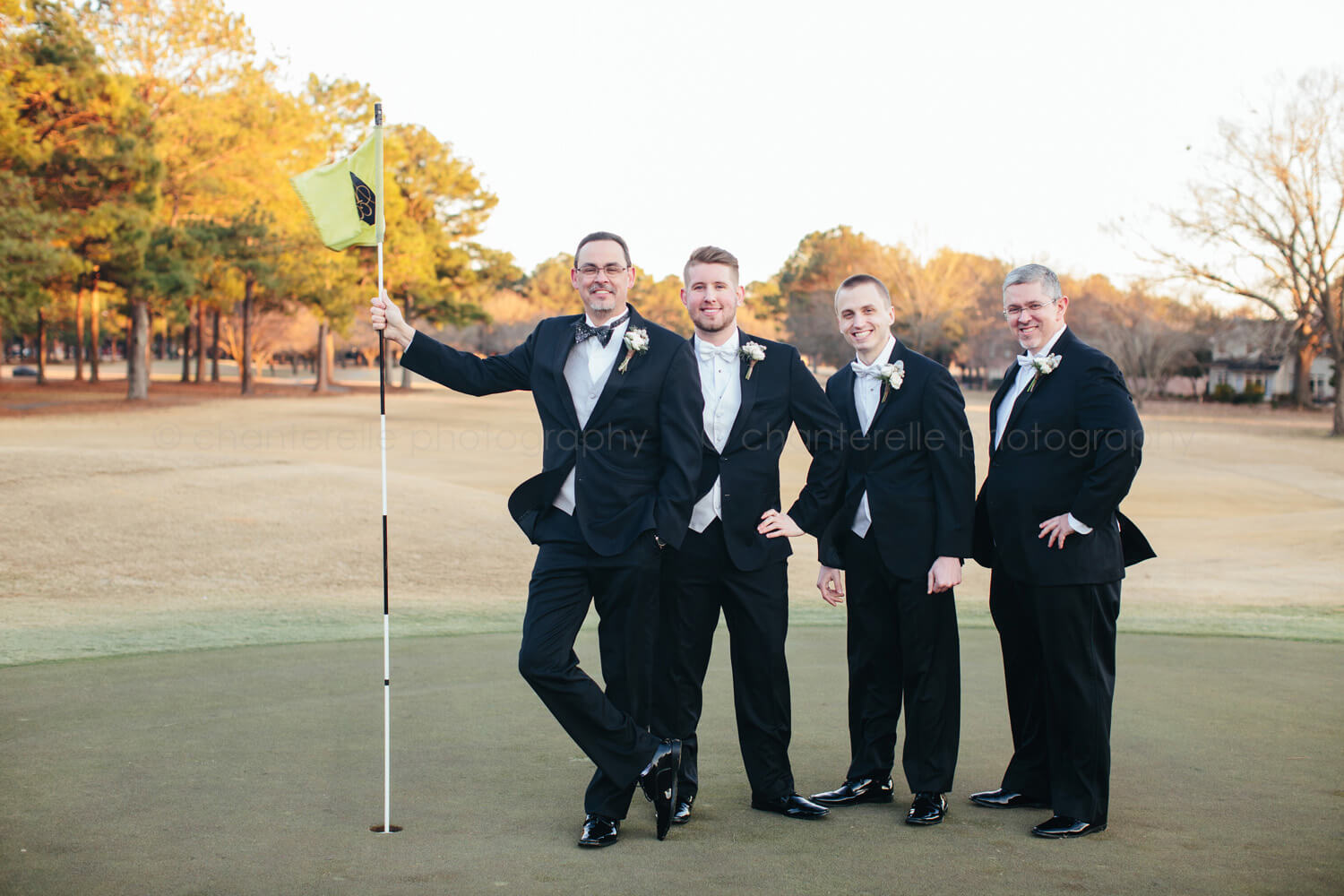 groom with groomsmen on golf course