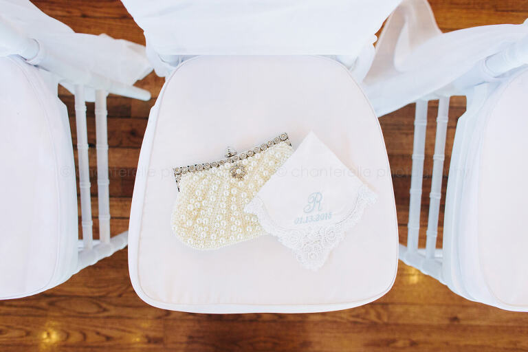 bride's purse and handkerchief on chair seat