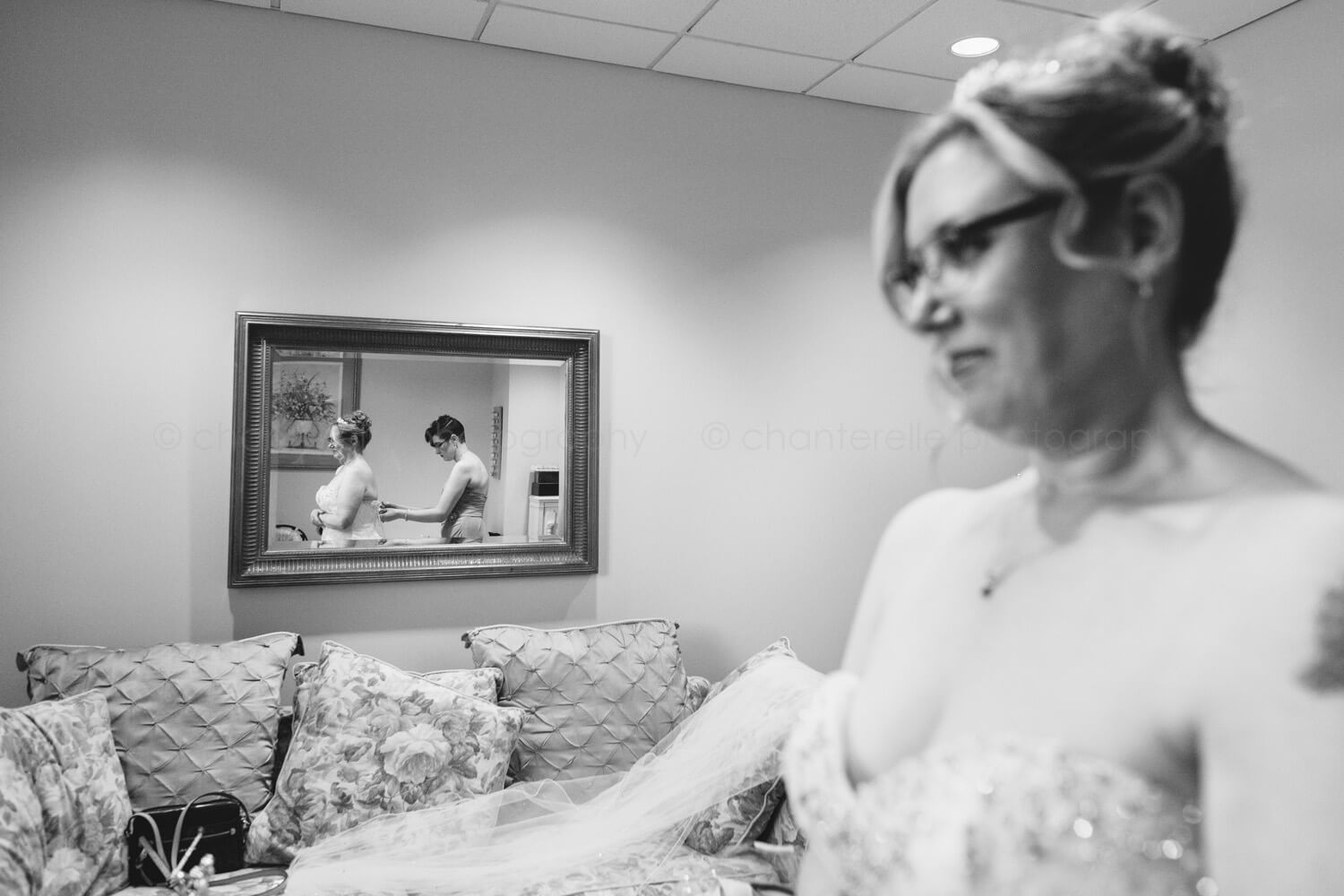 bride getting dressed before ceremony