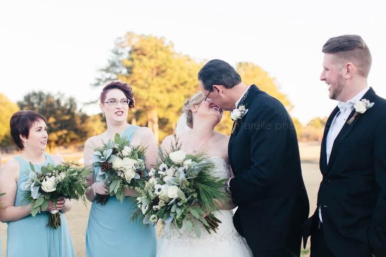 bride's daughter making faces at mom and stepdad