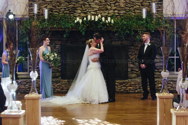 bride and groom kiss during arrowhead country club ceremony