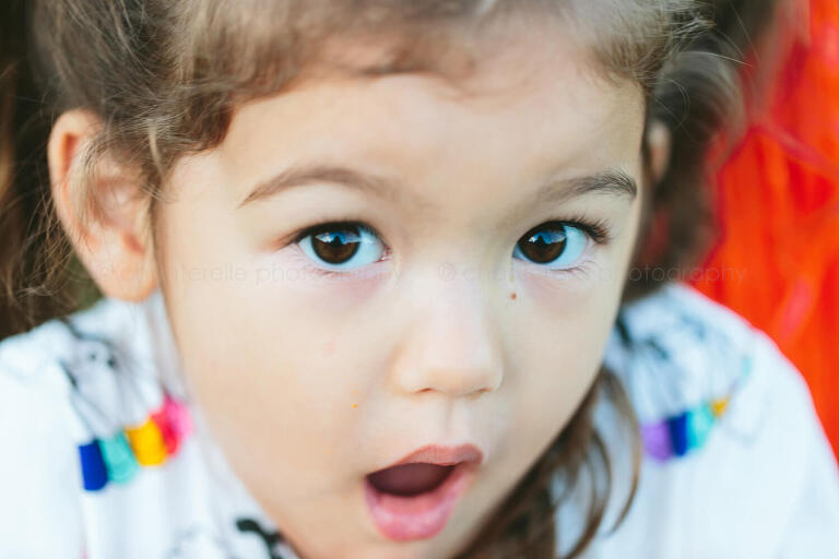 toddler girl with brown eyes closeup