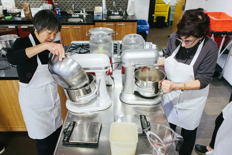 iacp attendees using kitchenaid mixers at culinary conference