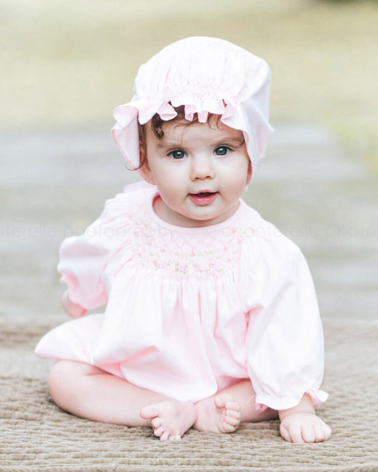 baby girl in pink bonnet at blount cultural park