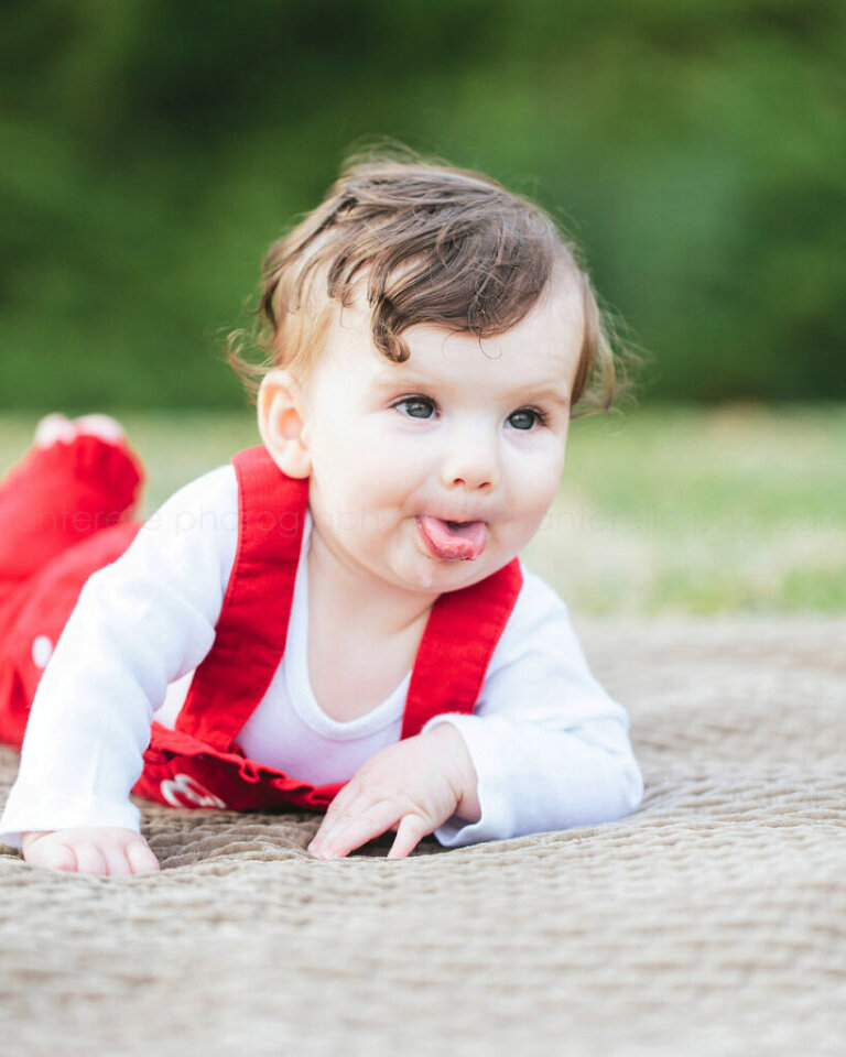 baby sticking tongue out at blount park