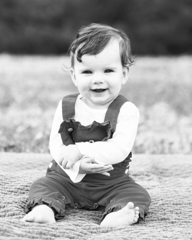 black and white picture of baby smiling at blount park