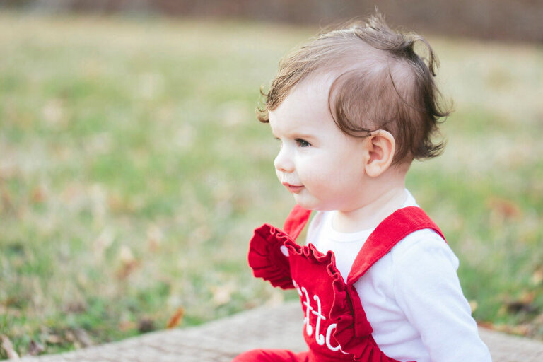 profile of baby in red overalls at blount cultural park
