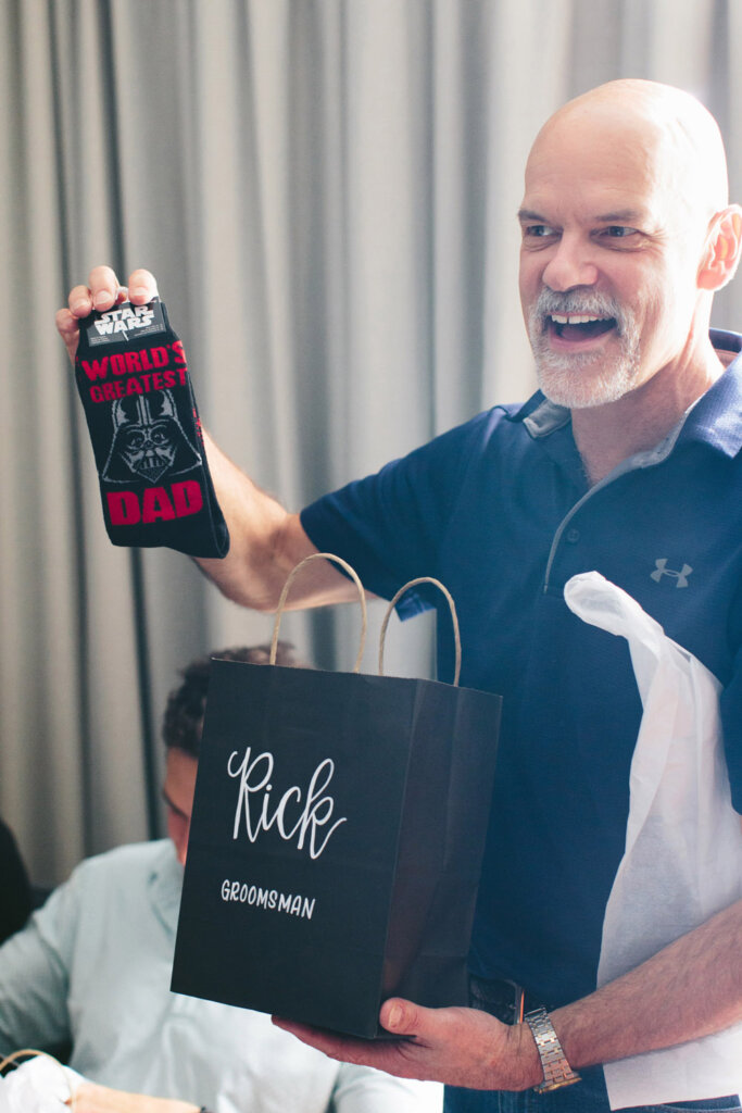 groom's dad opening groomsman gift