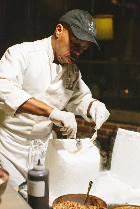 chef mixing ice cream in a block of dry ice